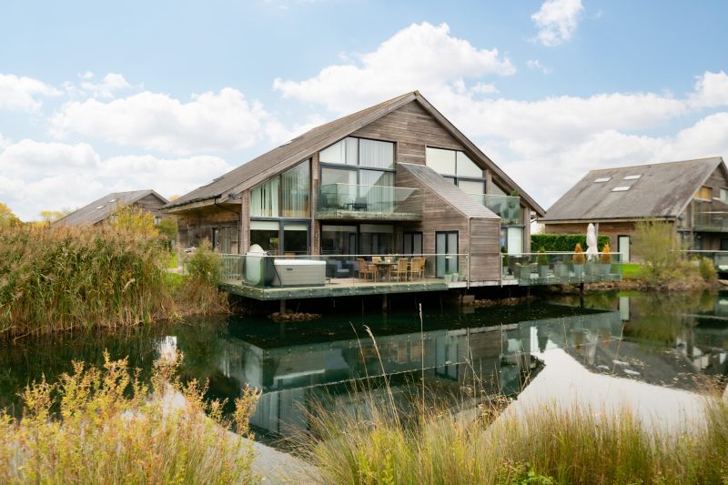 Four bedroom lakeside holiday lodge in the Cotswolds overlooking tranquil water and countryside.