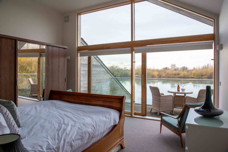 Principal bedroom at a luxury lake lodge in the Cotswolds