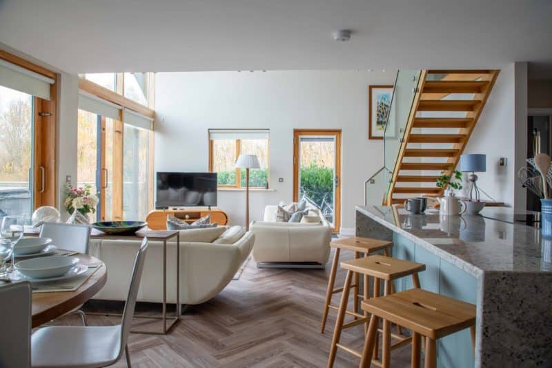 Open-plan living space at a luxury lake lodge in the Cotswolds