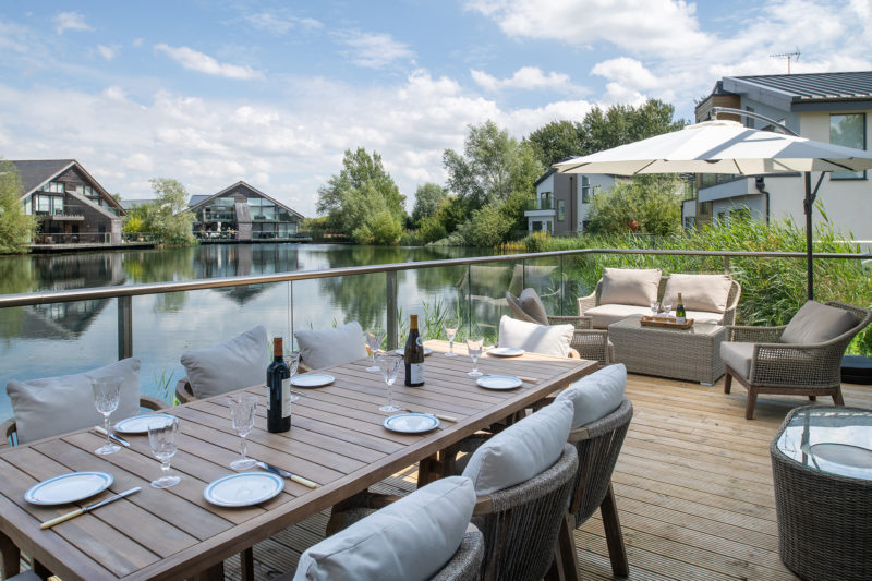 Lakeside deck at a luxury lake stay in the Cotswolds
